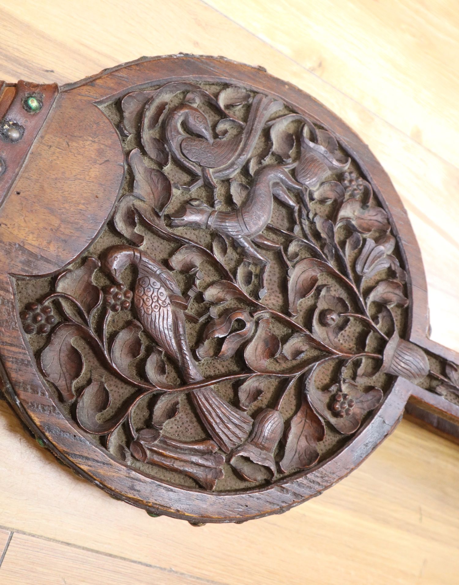 A pair of carved oak fire bellows